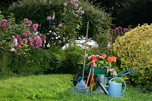 Gardener pricing a front garden tidy-up in Brunswick Park